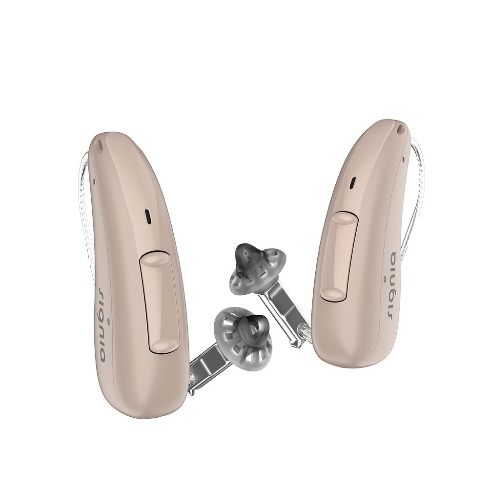 A pair of discreet beige Signia Charge and Go 3AX 7AX hearing aids profile
