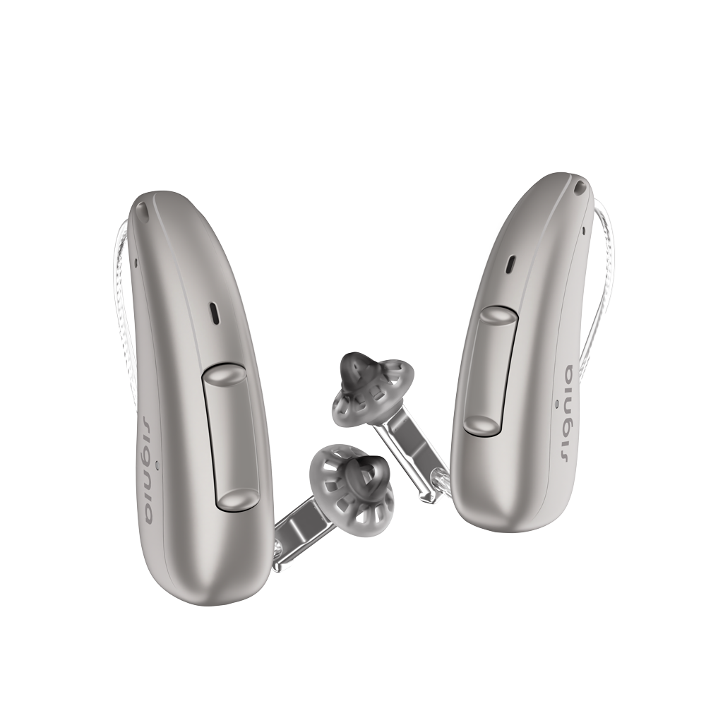 A pair of discreet champagne Signia Charge and Go 3AX 7AX hearing aids profile