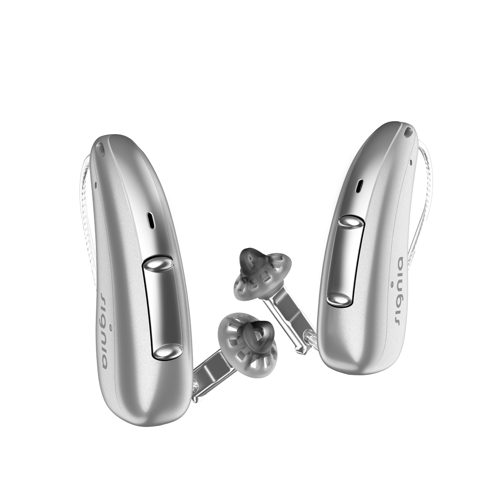 A pair of discreet Silver Gold Signia Charge and Go 3AX 7AX hearing aids profil
